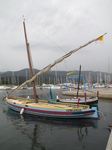 SX27573 Traditional Catalan sailboat in Argeles-sur-Mer harbour in the rain.jpg